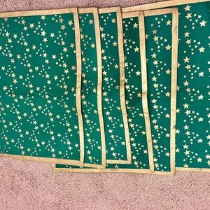 6 Holiday Placemats Green with Gold trim and Gold stars.